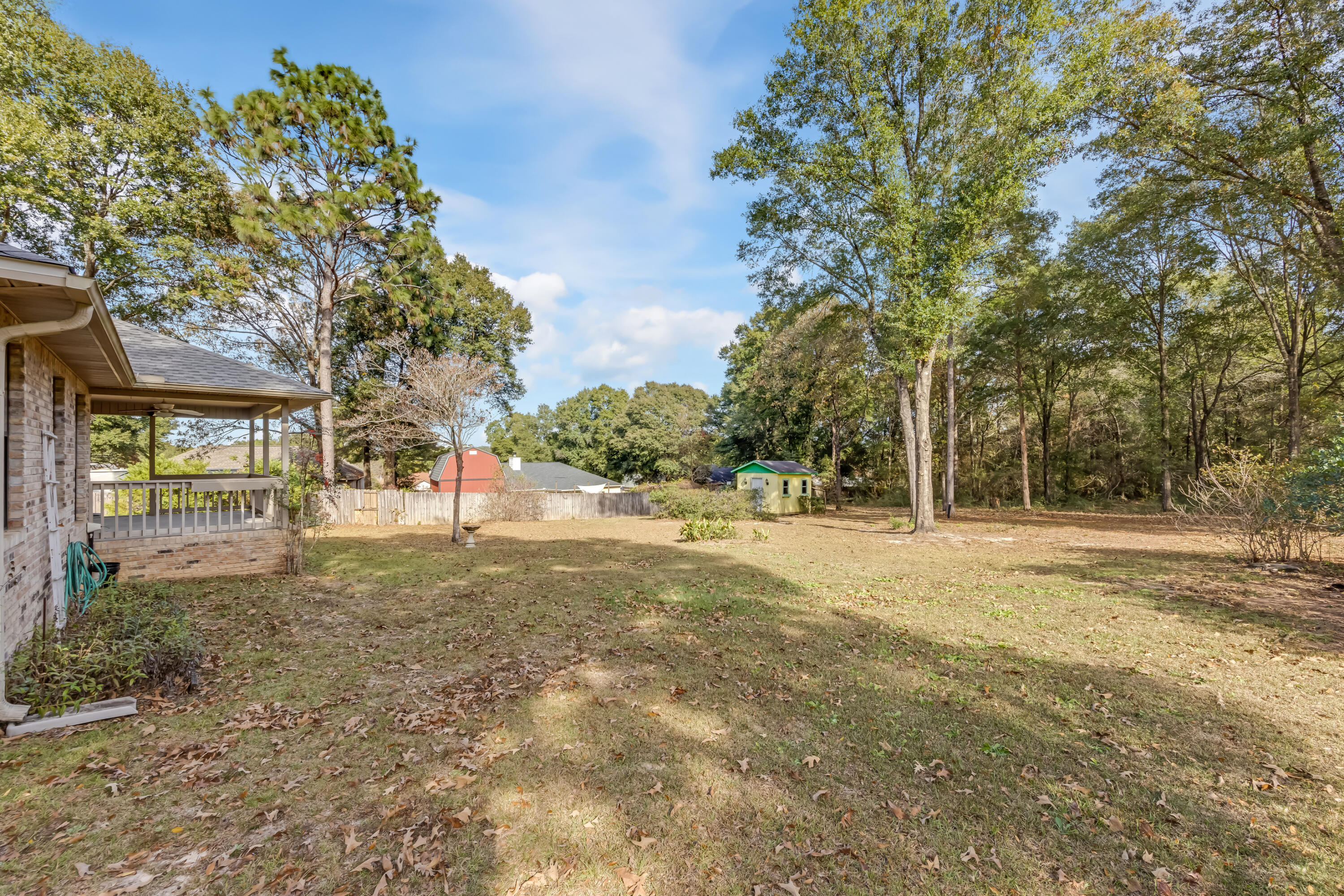 5965 Oak Hill Road Crestview, FL 32536 - Photo 39 of 44 a view of a yard with a tree