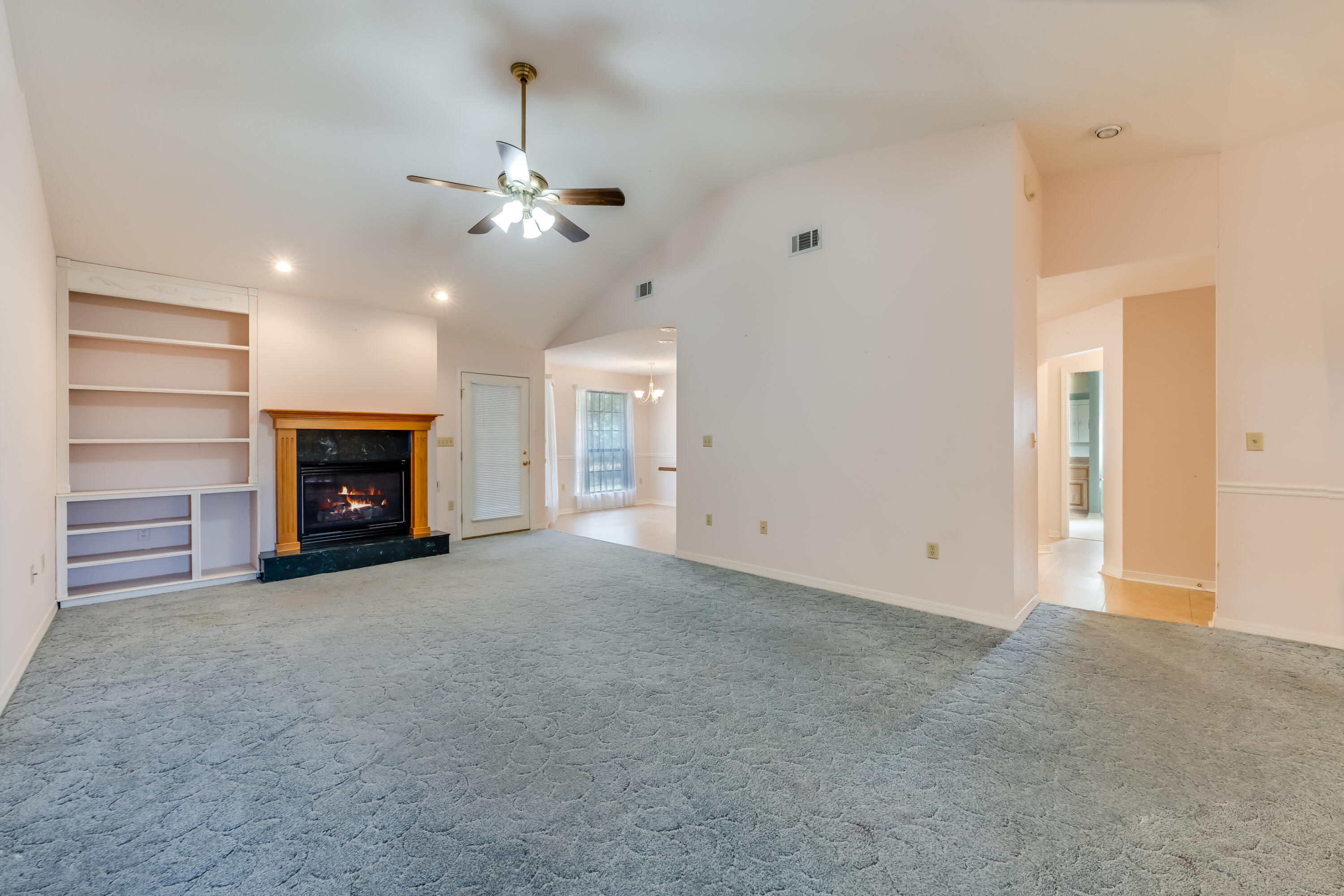 5965 Oak Hill Road Crestview, FL 32536 - Photo 4 of 44 a view of an empty room with a fireplace