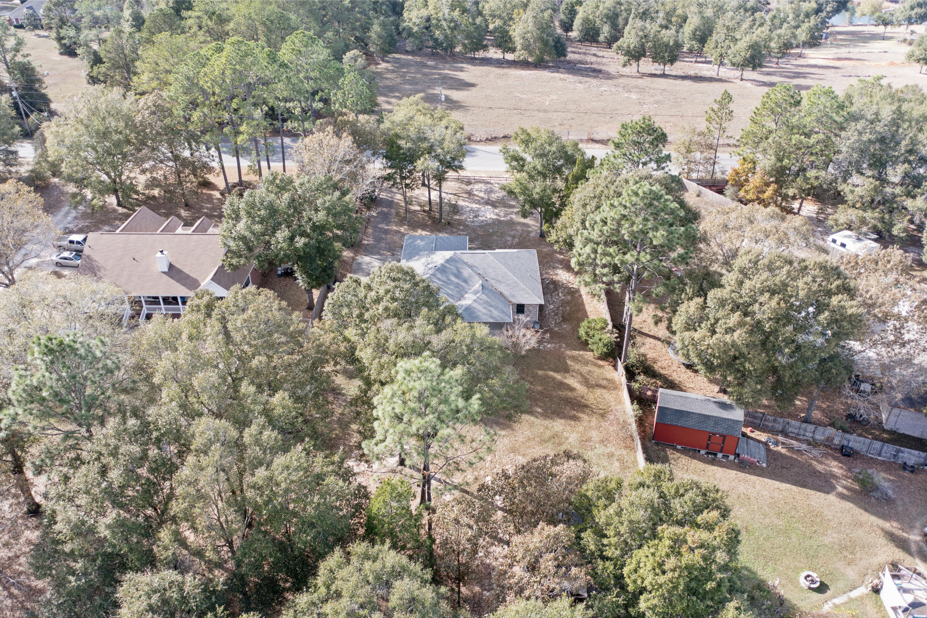 5965 Oak Hill Road Crestview, FL 32536 - Photo 42 of 44 an aerial view of a house with a yard and garden