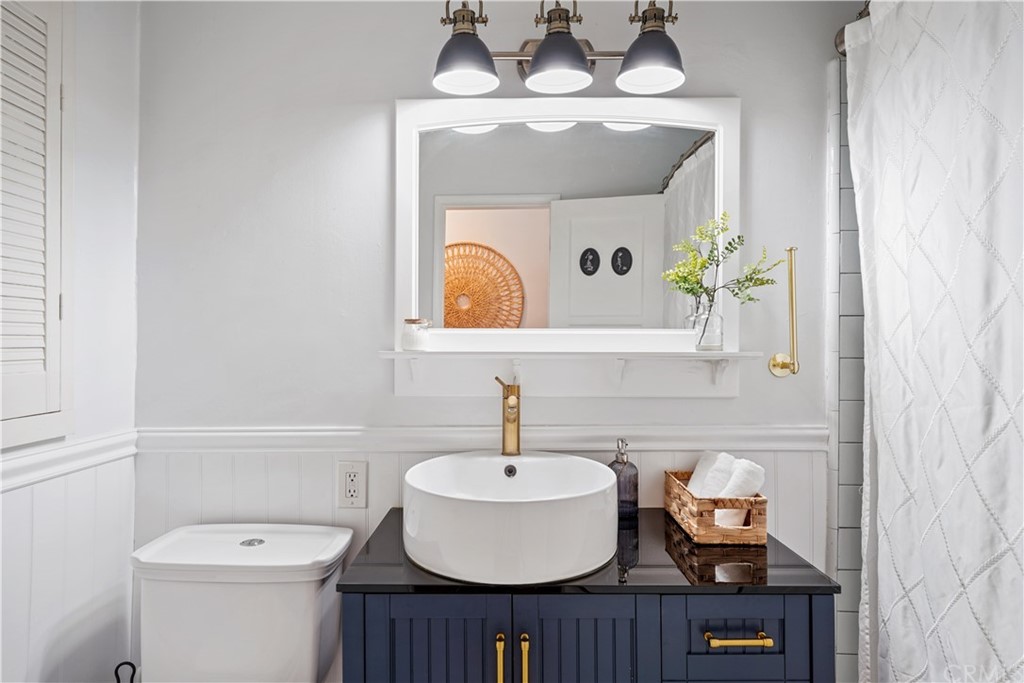 14709 Bodger Avenue Hawthorne, CA 90250 - Photo 14 of 24 a bathroom with a sink and a mirror