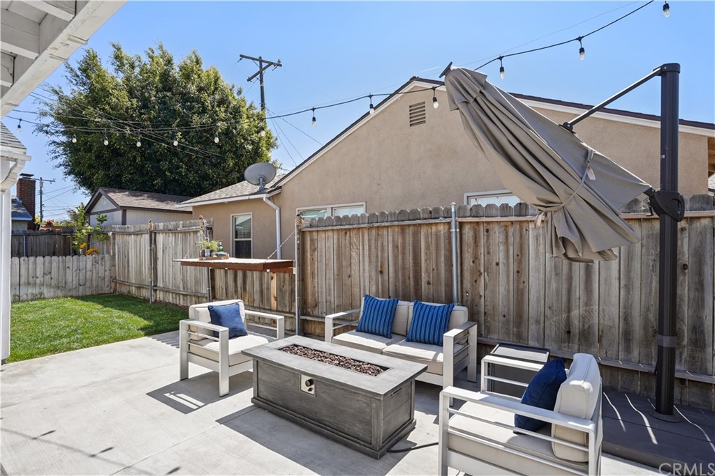 14709 Bodger Avenue Hawthorne, CA 90250 - Photo 17 of 24 a view of a patio with couches table and chairs and potted plants