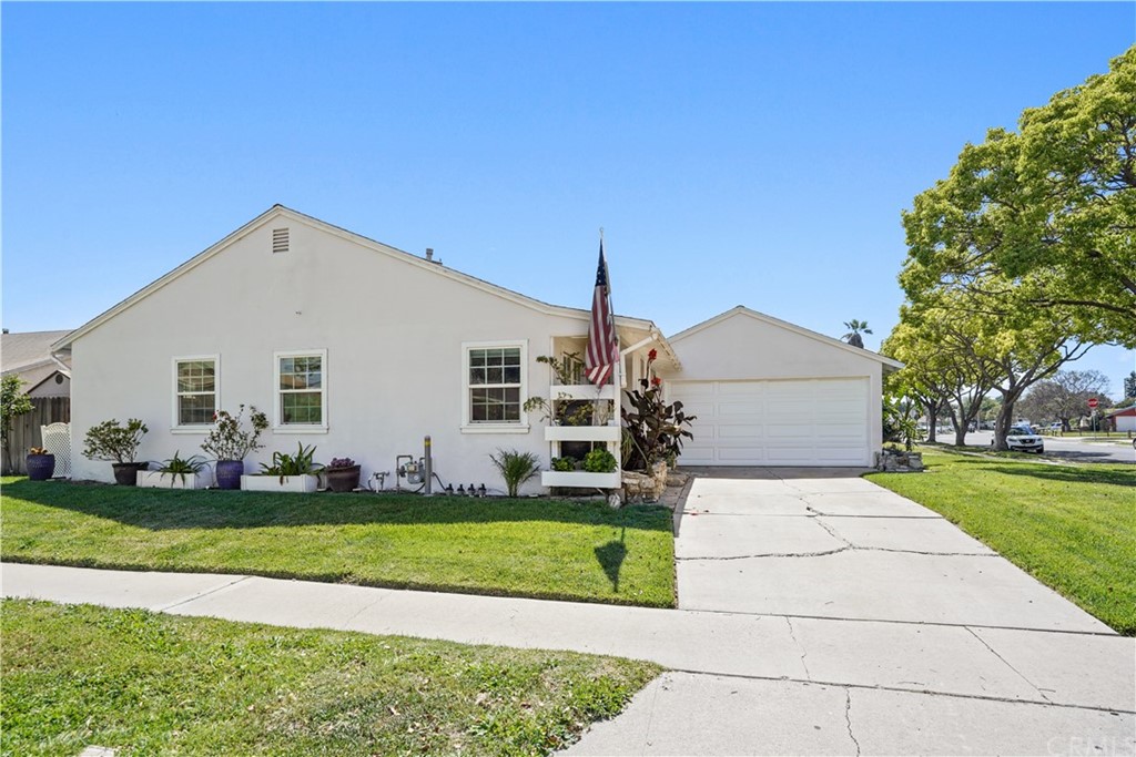 14709 Bodger Avenue Hawthorne, CA 90250 - Photo 22 of 24 a front view of a house with a yard and garage