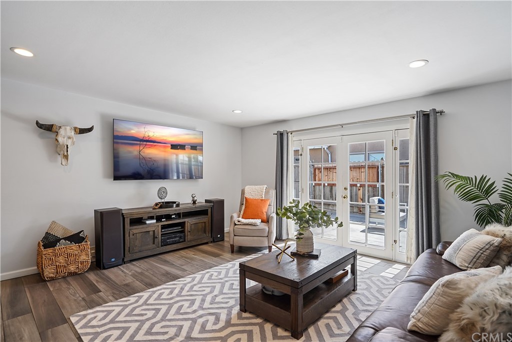14709 Bodger Avenue Hawthorne, CA 90250 - Photo 4 of 24 a living room with furniture and a flat screen tv