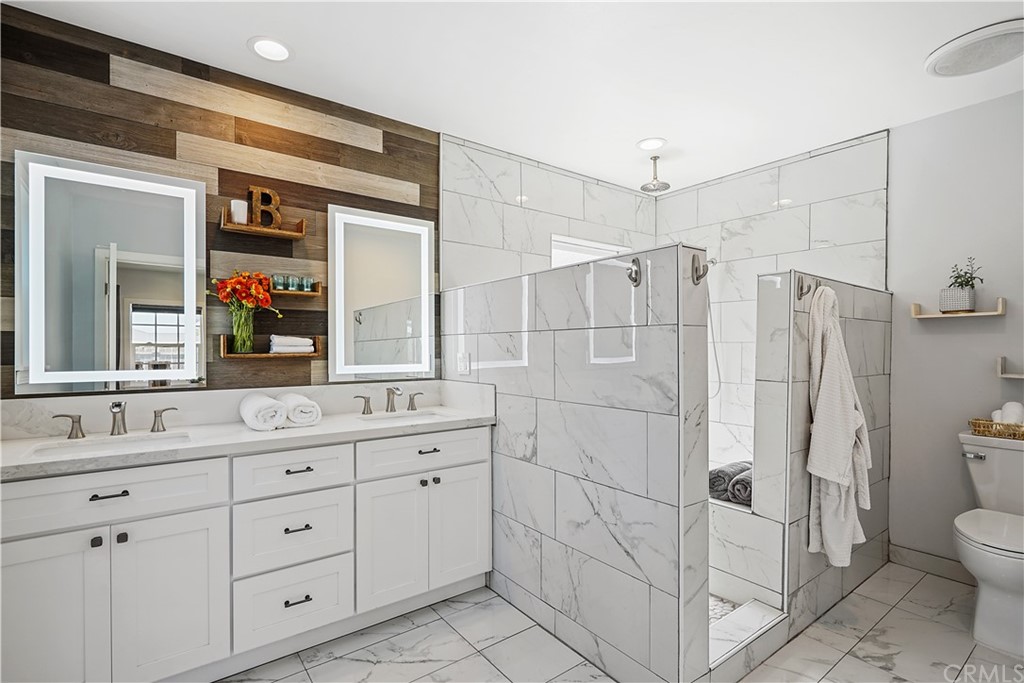 14709 Bodger Avenue Hawthorne, CA 90250 - Photo 10 of 24 a bathroom with a double vanity sink toilet and shower