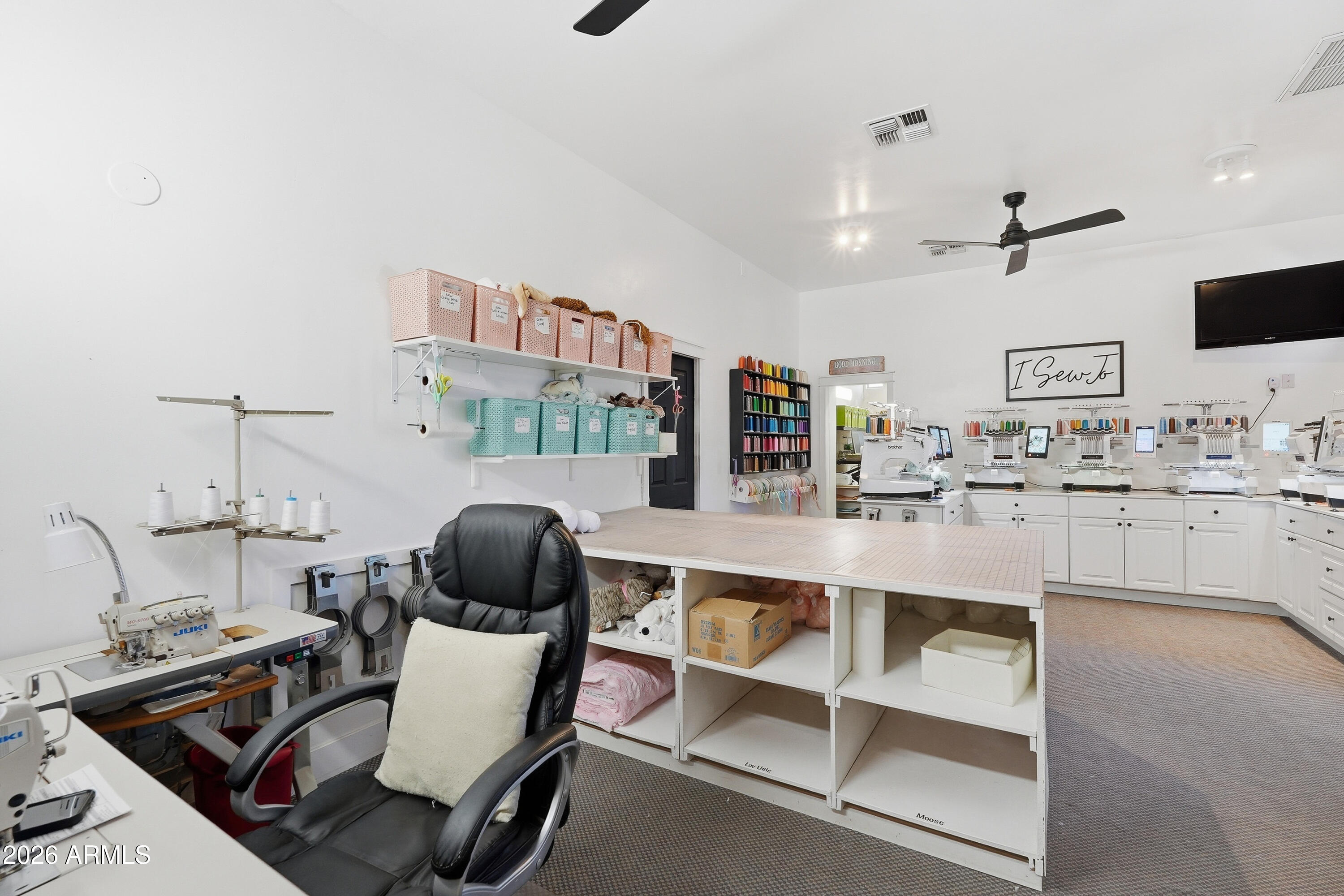 2616 West Canyon Road Phoenix, AZ 85086 - Photo 24 of 45 a room with a chair and white walls