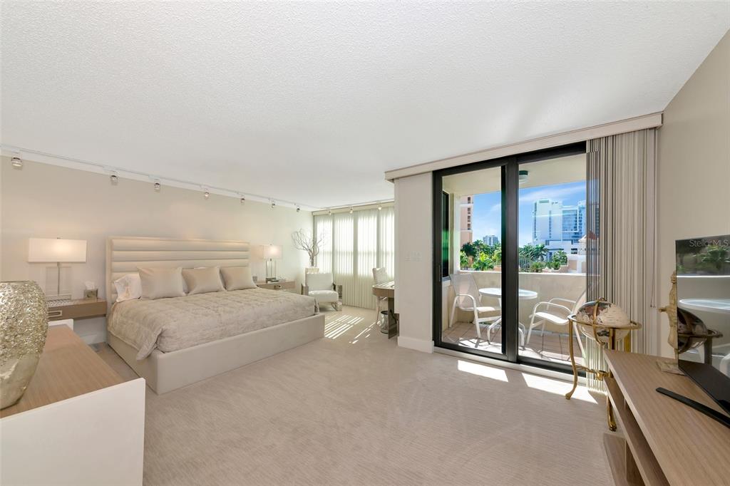 101 Sunset Drive, Unit PH3 Sarasota, FL 34236 - Photo 13 of 47 a large bedroom with a large bed and large windows