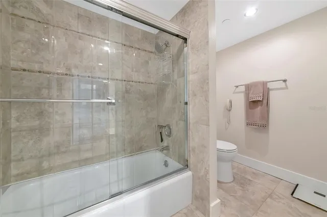 a bathroom with a bathtub and a toilet