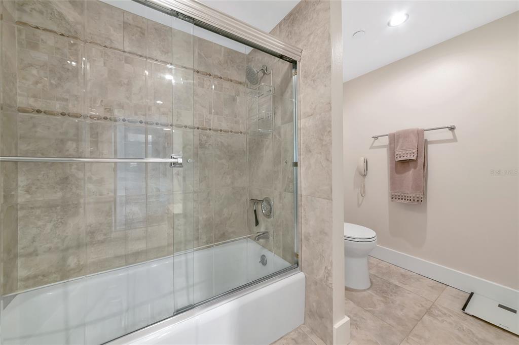 101 Sunset Drive, Unit PH3 Sarasota, FL 34236 - Photo 18 of 47 a bathroom with a bathtub and a toilet