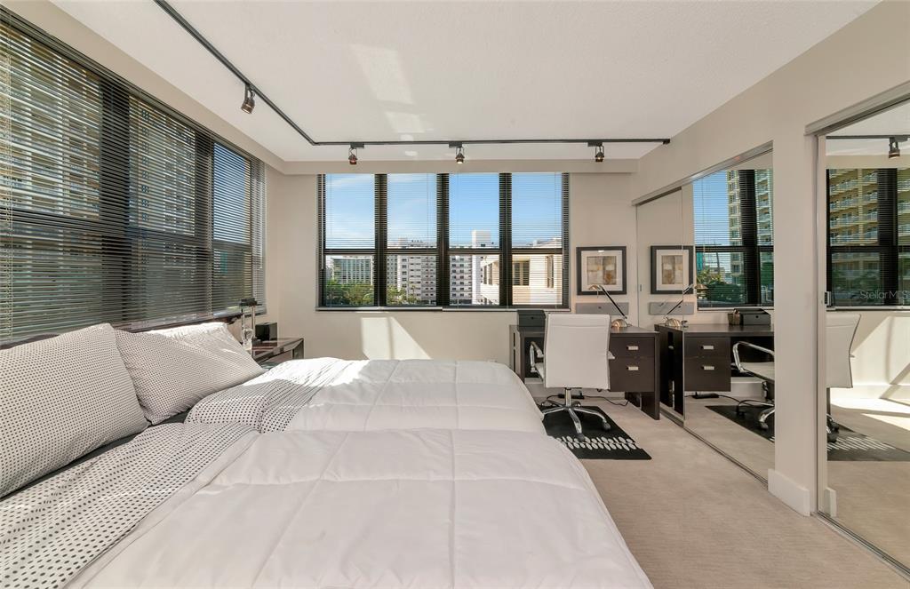 101 Sunset Drive, Unit PH3 Sarasota, FL 34236 - Photo 20 of 47 a living room with furniture large window and flat screen tv