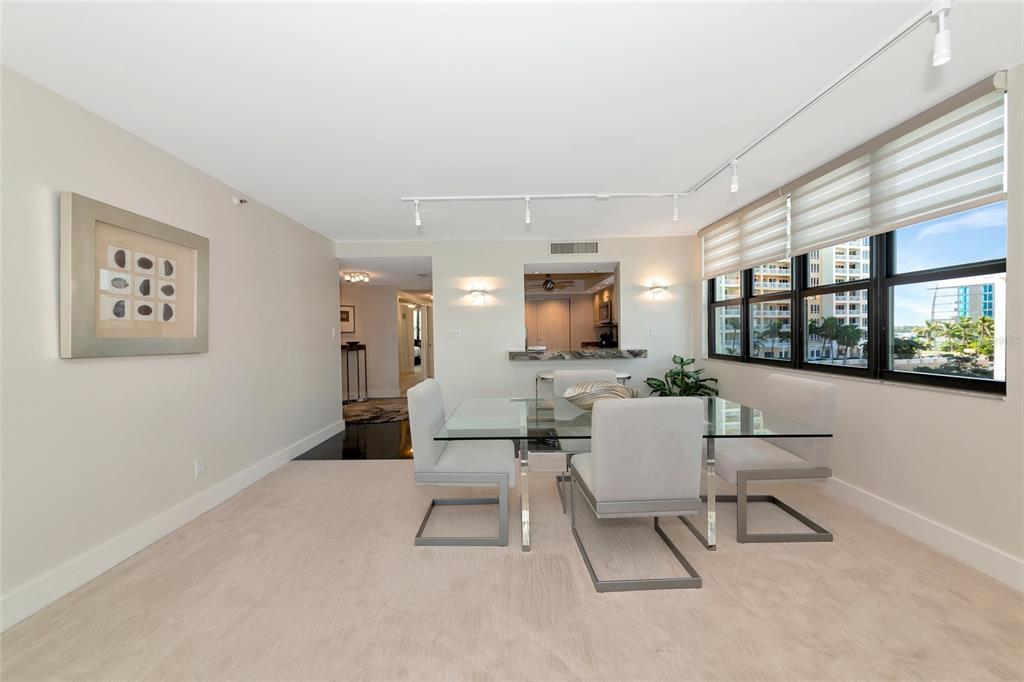 101 Sunset Drive, Unit PH3 Sarasota, FL 34236 - Photo 21 of 47 a living room with furniture and a large window