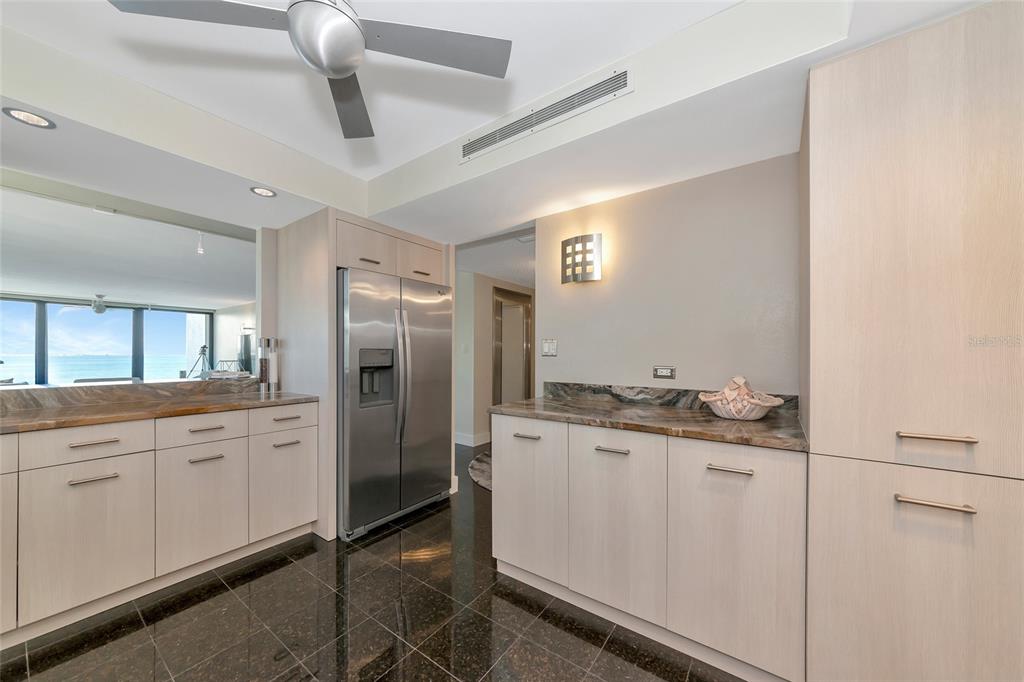 101 Sunset Drive, Unit PH3 Sarasota, FL 34236 - Photo 29 of 47 a spacious bathroom with a granite countertop sink a toilet and a mirror