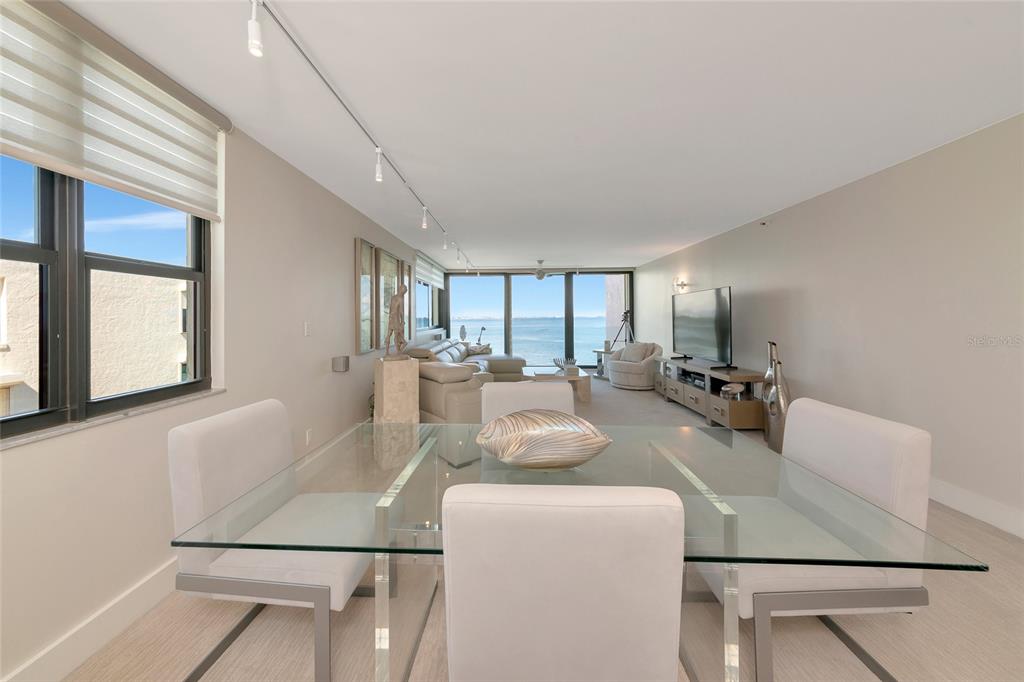 101 Sunset Drive, Unit PH3 Sarasota, FL 34236 - Photo 32 of 47 a living room with furniture and a large window