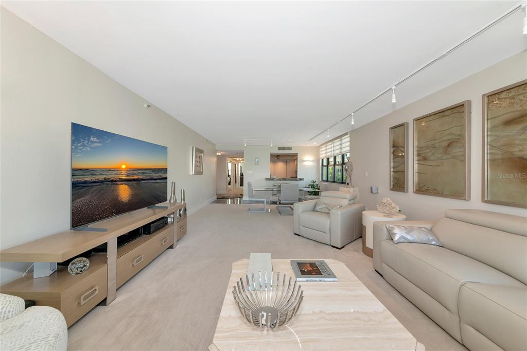 101 Sunset Drive, Unit PH3 Sarasota, FL 34236 - Photo 34 of 47 a living room with furniture and a flat screen tv