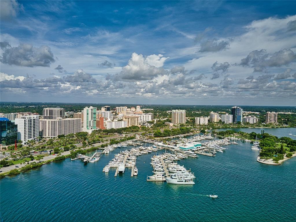 101 Sunset Drive, Unit PH3 Sarasota, FL 34236 - Photo 45 of 47 a front view of a house with garden