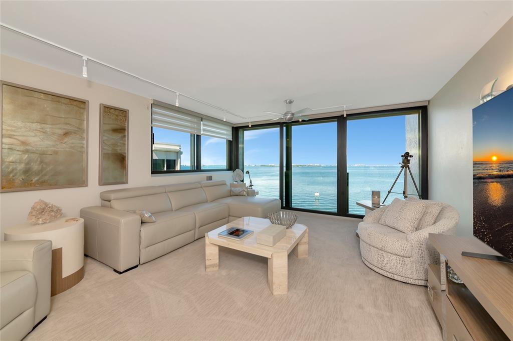 101 Sunset Drive, Unit PH3 Sarasota, FL 34236 - Photo 6 of 47 a living room with furniture and a large window