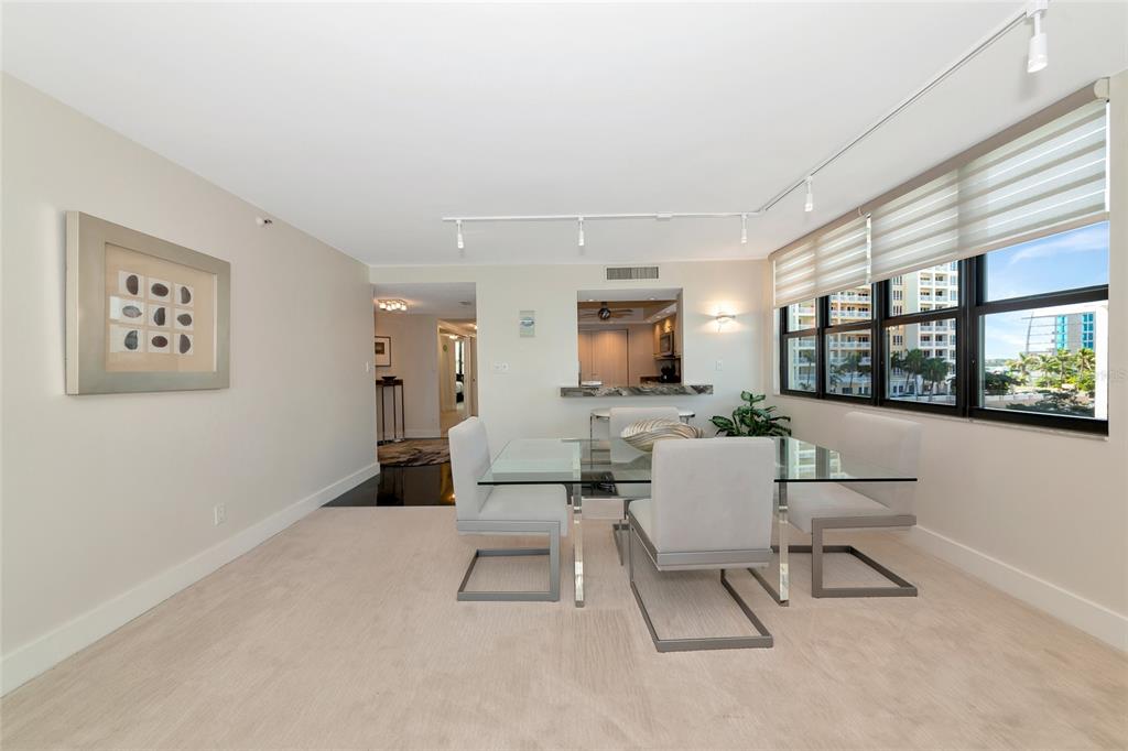 101 Sunset Drive, Unit PH3 Sarasota, FL 34236 - Photo 9 of 47 a living room with furniture and a flat screen tv