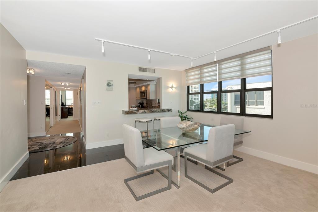 101 Sunset Drive, Unit PH3 Sarasota, FL 34236 - Photo 10 of 47 a view of a dining room with furniture