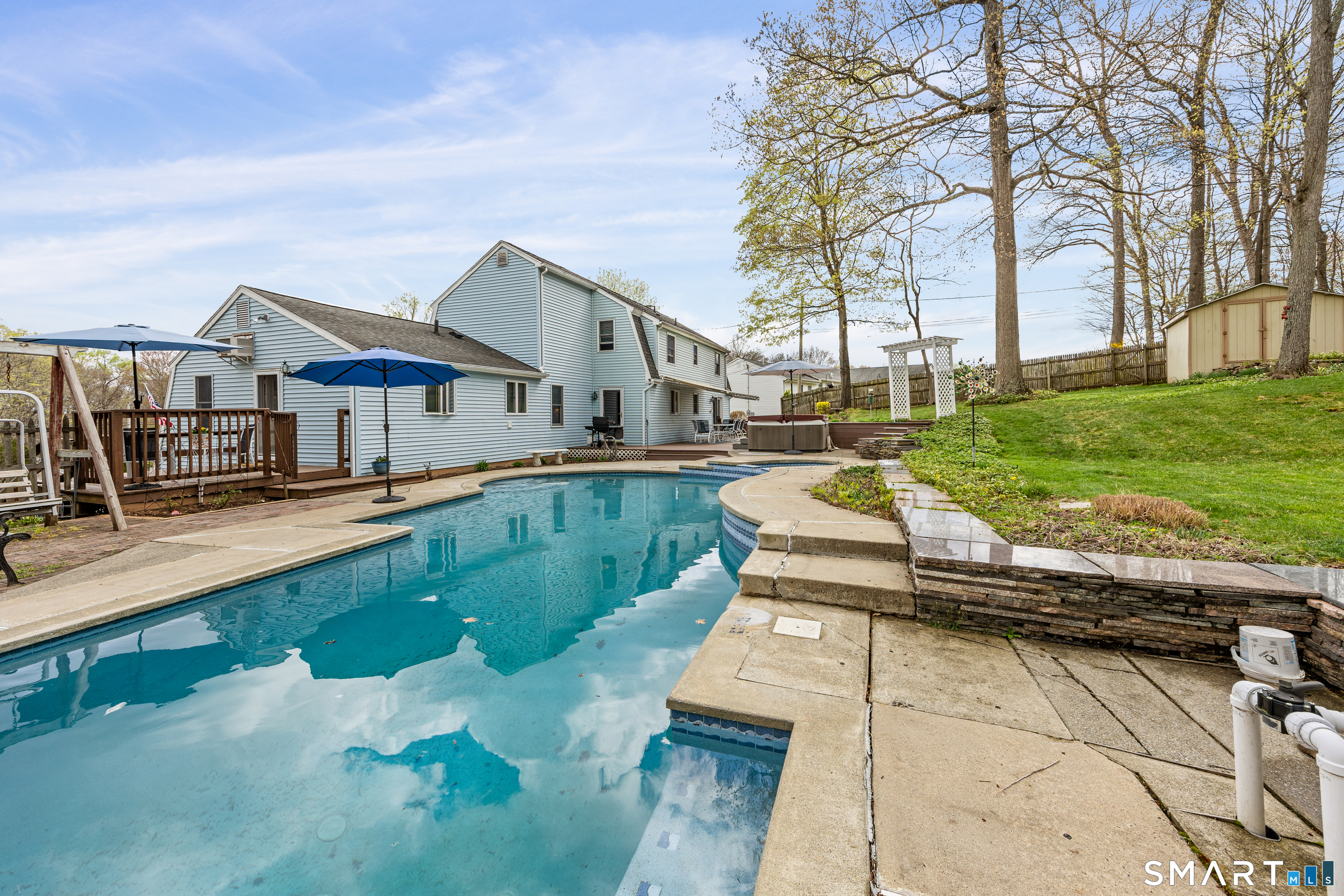 42 Chimney Sweep Road Wallingford, CT 06492 - Photo 8 of 40 a view of a house with a yard patio and fire pit