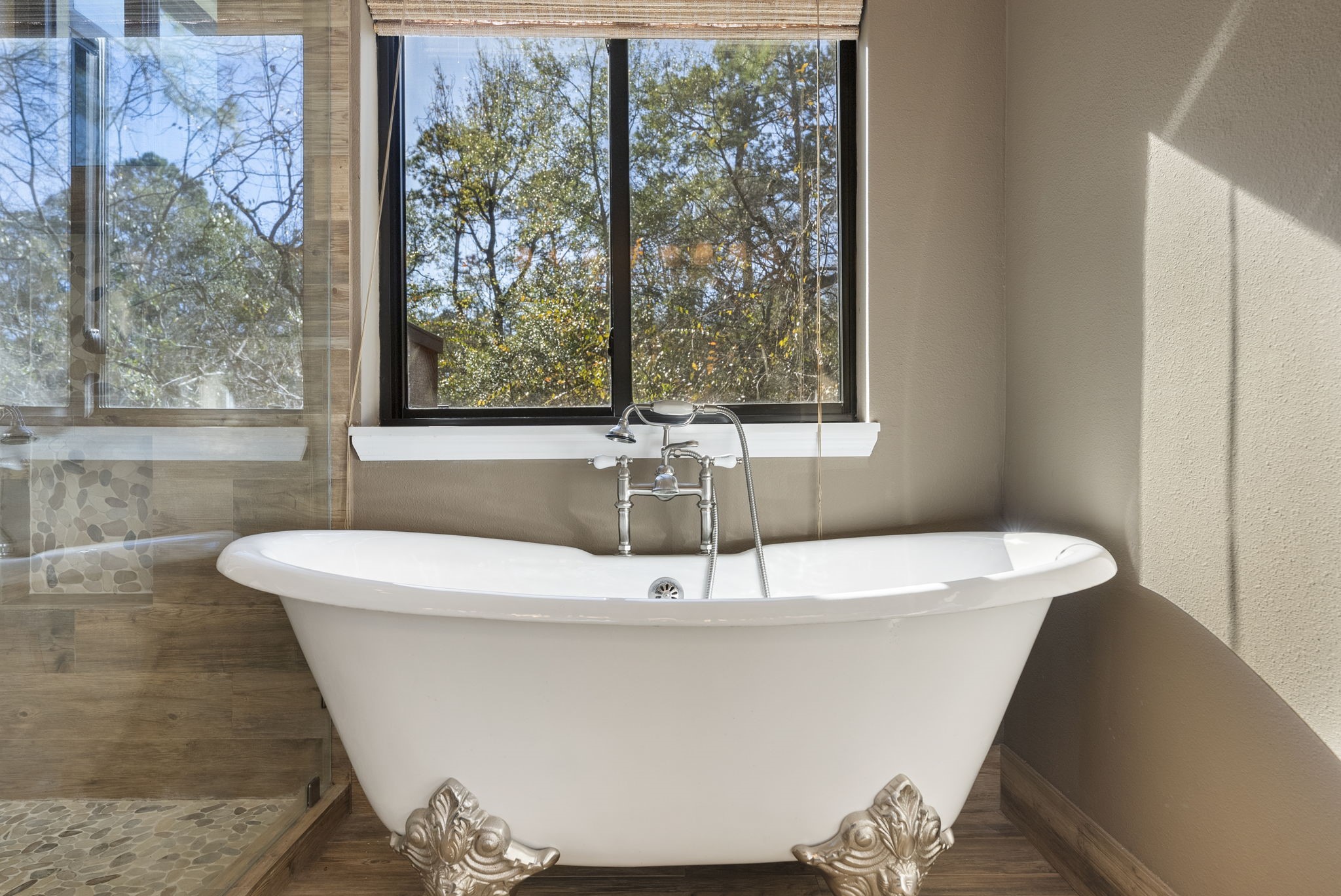 98 South Wilde Yaupon Court Spring, TX 77381 - Photo 13 of 49 Unwind while taking in the relaxing view from the stand-alone tub.