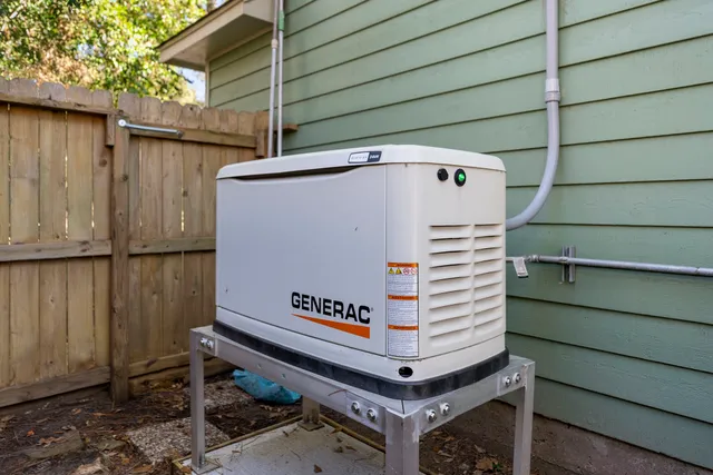 a view of backyard with wooden deck and seating