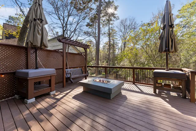 a view of balcony with wooden floor and outdoor seating