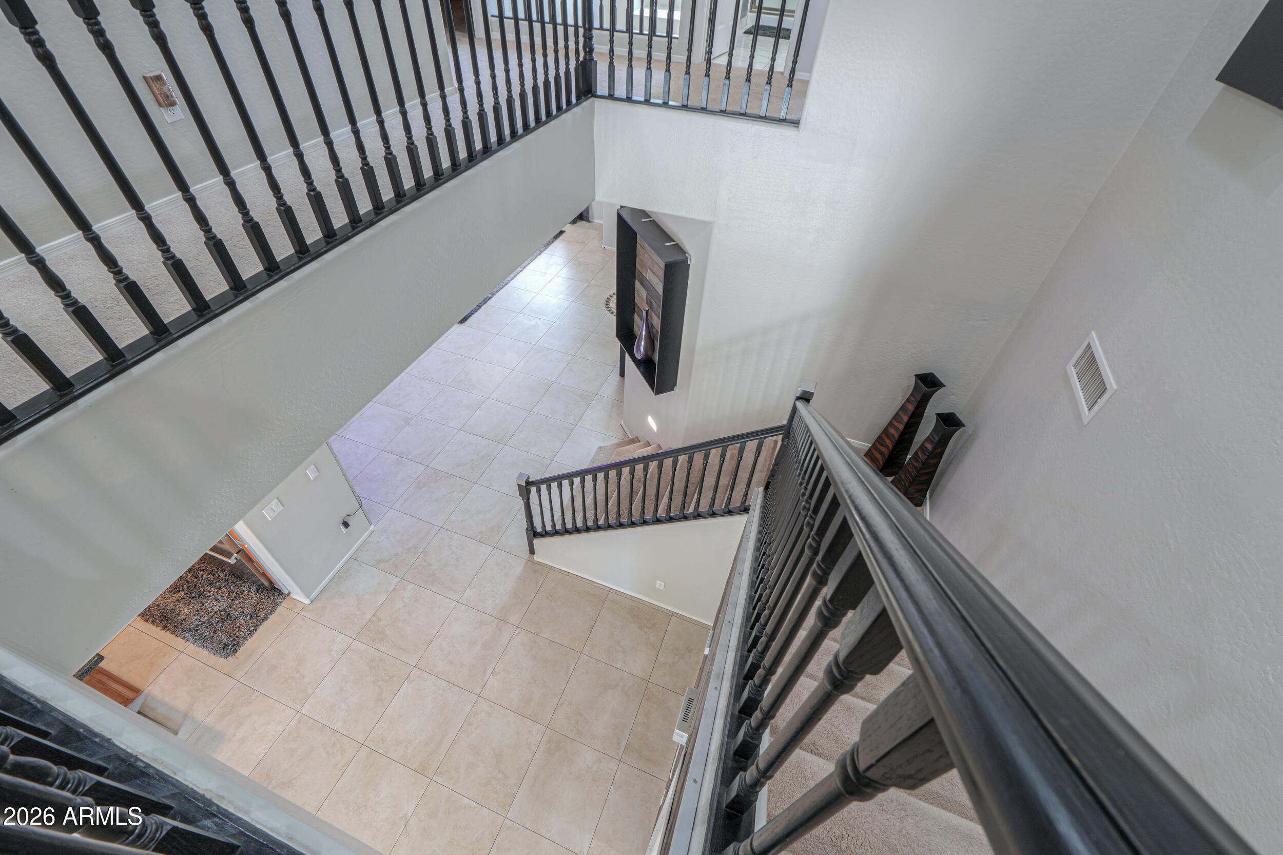 45247 West Jack Rabbit Trail Maricopa, AZ 85139 - Photo 30 of 75 a view of staircase with black white walls