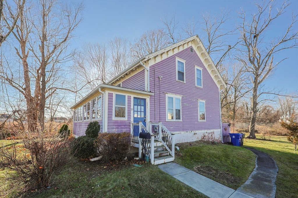 69 Cutler Street Warren, RI 02885 - Photo 2 of 13 a front view of a house with garden