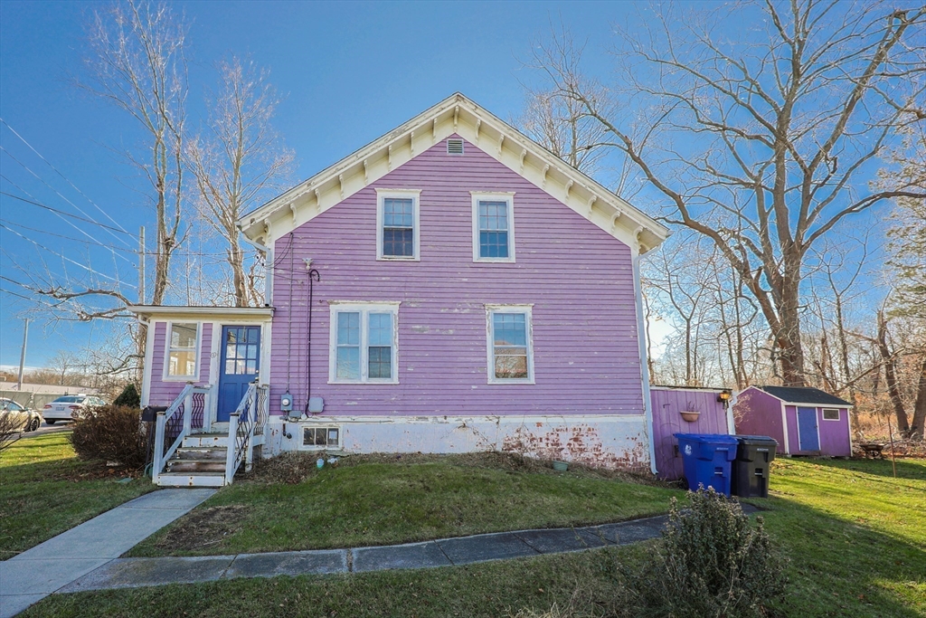 69 Cutler Street Warren, RI 02885 - Photo 3 of 13 a front view of house with yard and green space