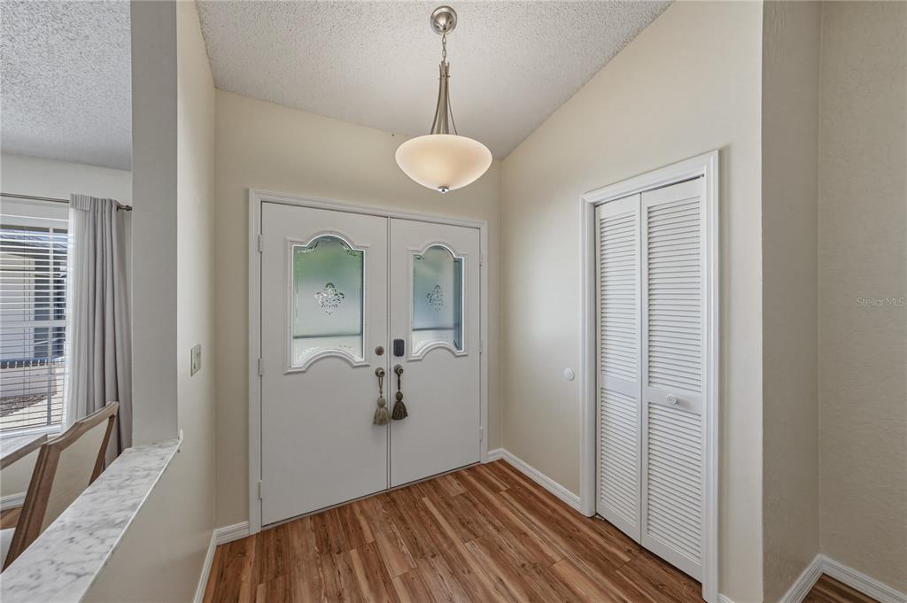 7435 Kilbride Court Weeki Wachee, FL 34613 - Photo 5 of 67 a view of a room with wooden floor and windows