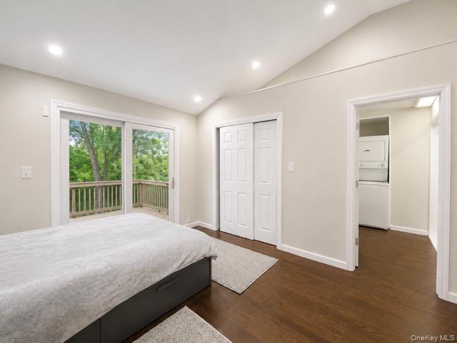321 Sherbrooke Road Lindenhurst, NY 11757 - Photo 10 of 21 Vaulted ceiling with recessed lighting, wood-finish flooring, sliding glass door to exterior decking, and bi-fold closet doors