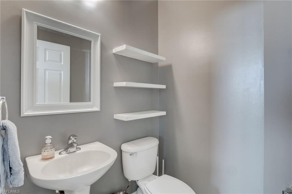 1654 Double Eagle Trail Naples, FL 34120 - Photo 18 of 48 Half bathroom