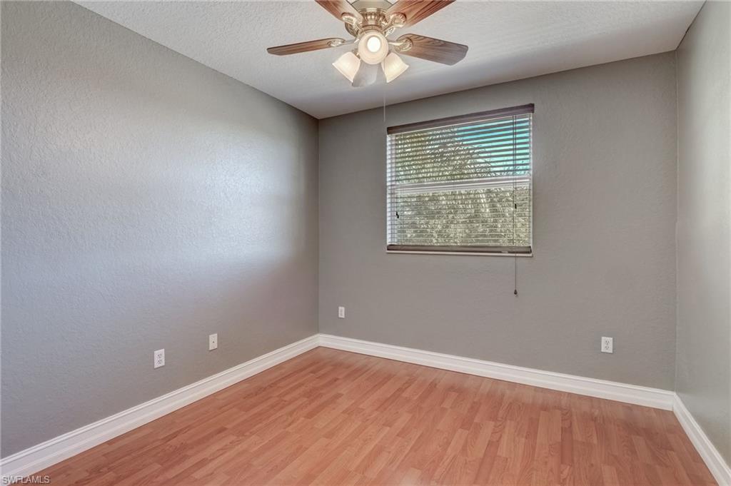 1654 Double Eagle Trail Naples, FL 34120 - Photo 41 of 48 Spare room with ceiling fan, a textured ceiling, and light wood-type flooring