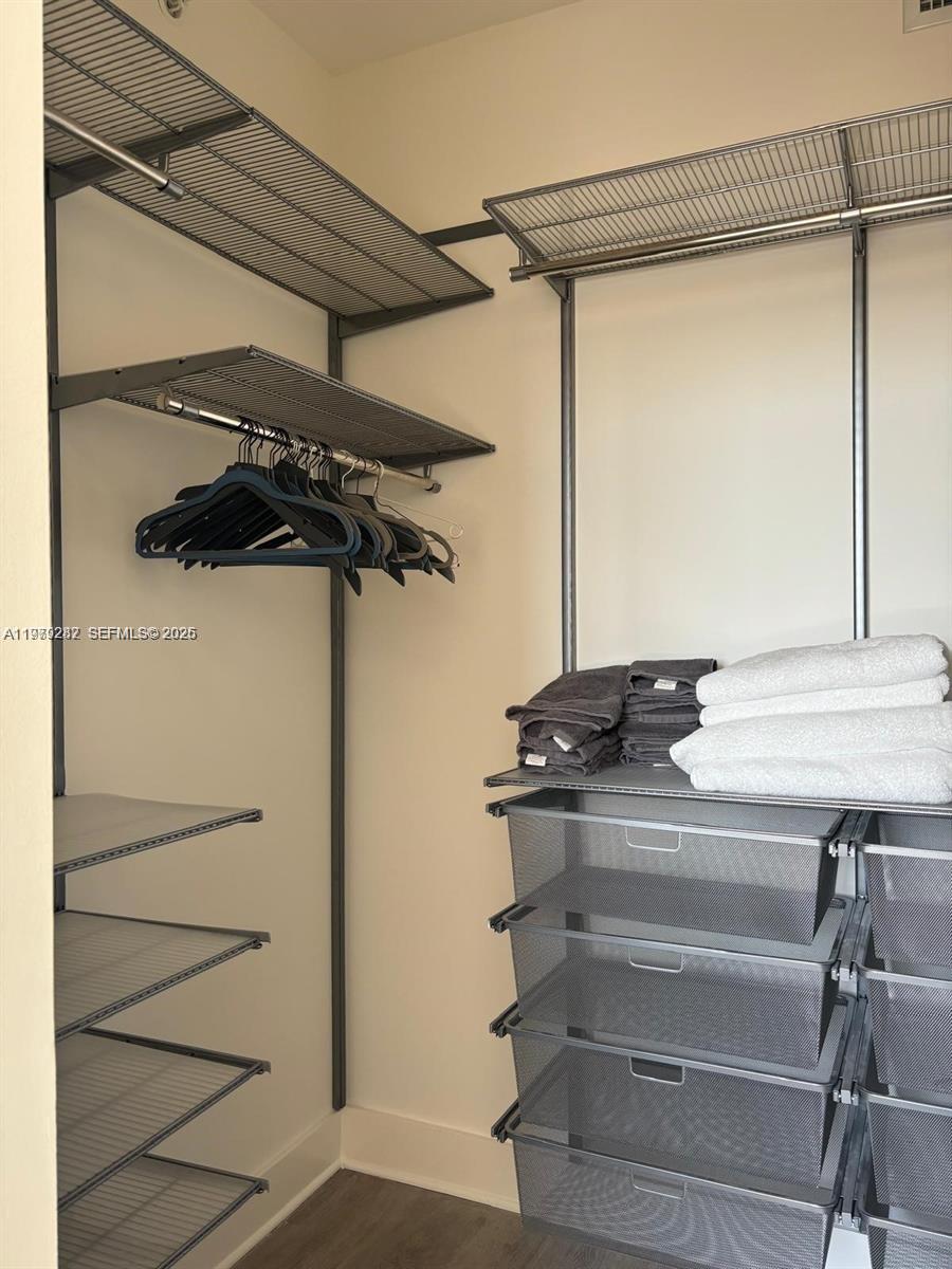 888 Douglas Road, Unit 1002 Coral Gables, FL 33134 - Photo 22 of 34 a view of a walk in closet