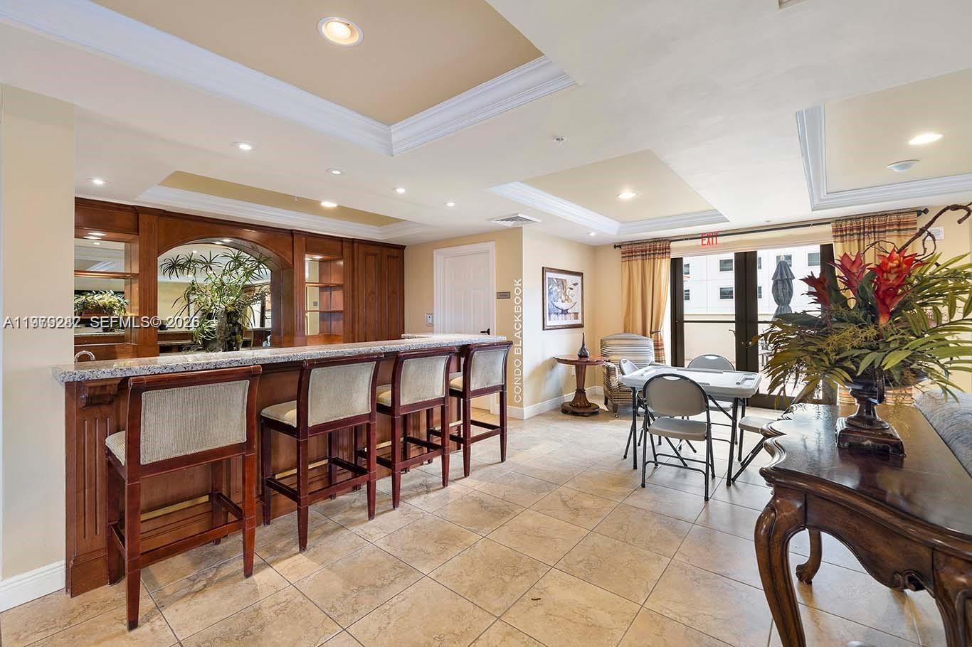 888 Douglas Road, Unit 1002 Coral Gables, FL 33134 - Photo 28 of 34 a view of a dining room with furniture window and outside view