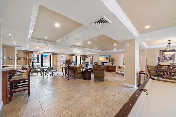 a living room with lots of furniture and lots of furniture