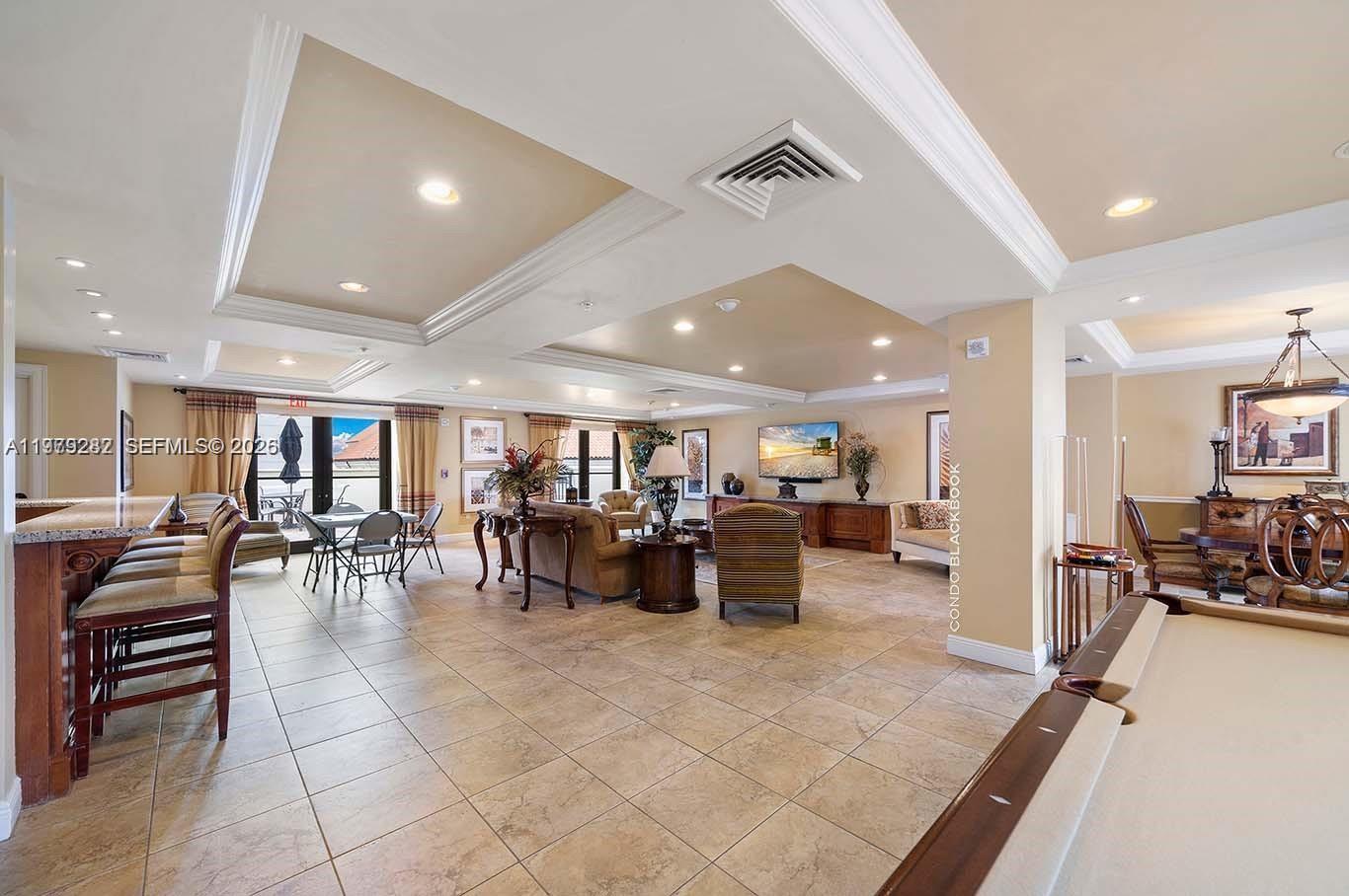 888 Douglas Road, Unit 1002 Coral Gables, FL 33134 - Photo 29 of 34 a living room with lots of furniture and lots of furniture