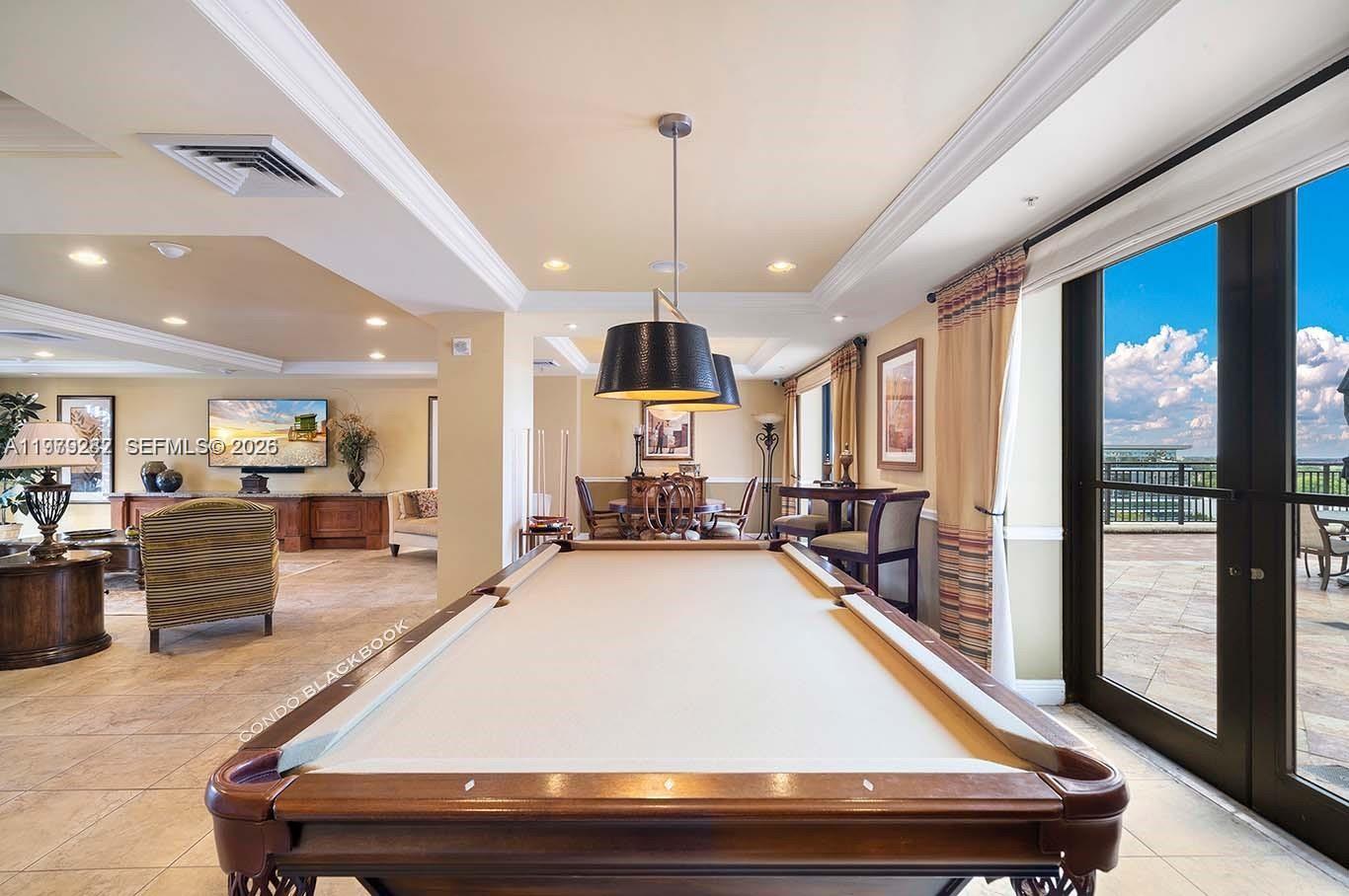 888 Douglas Road, Unit 1002 Coral Gables, FL 33134 - Photo 30 of 34 a room with pool table and windows