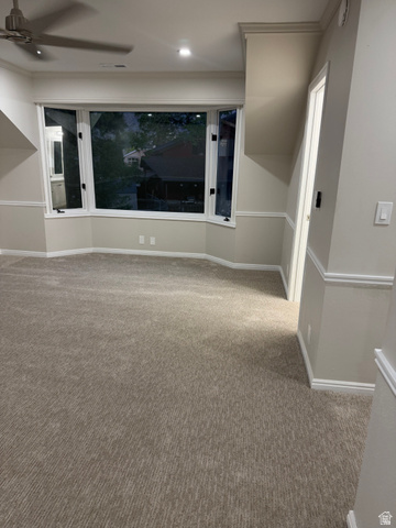 8965 Quail Run Drive Sandy, UT 84093 - Photo 38 of 56 Empty room with carpet flooring and a ceiling fan