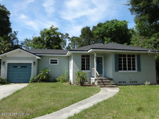 9765 Cunningham Road Jacksonville, FL 32246 - Photo 1 of 13 front view of a house with a yard
