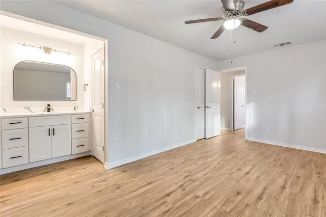 a view of a double vanity sink and a mirror