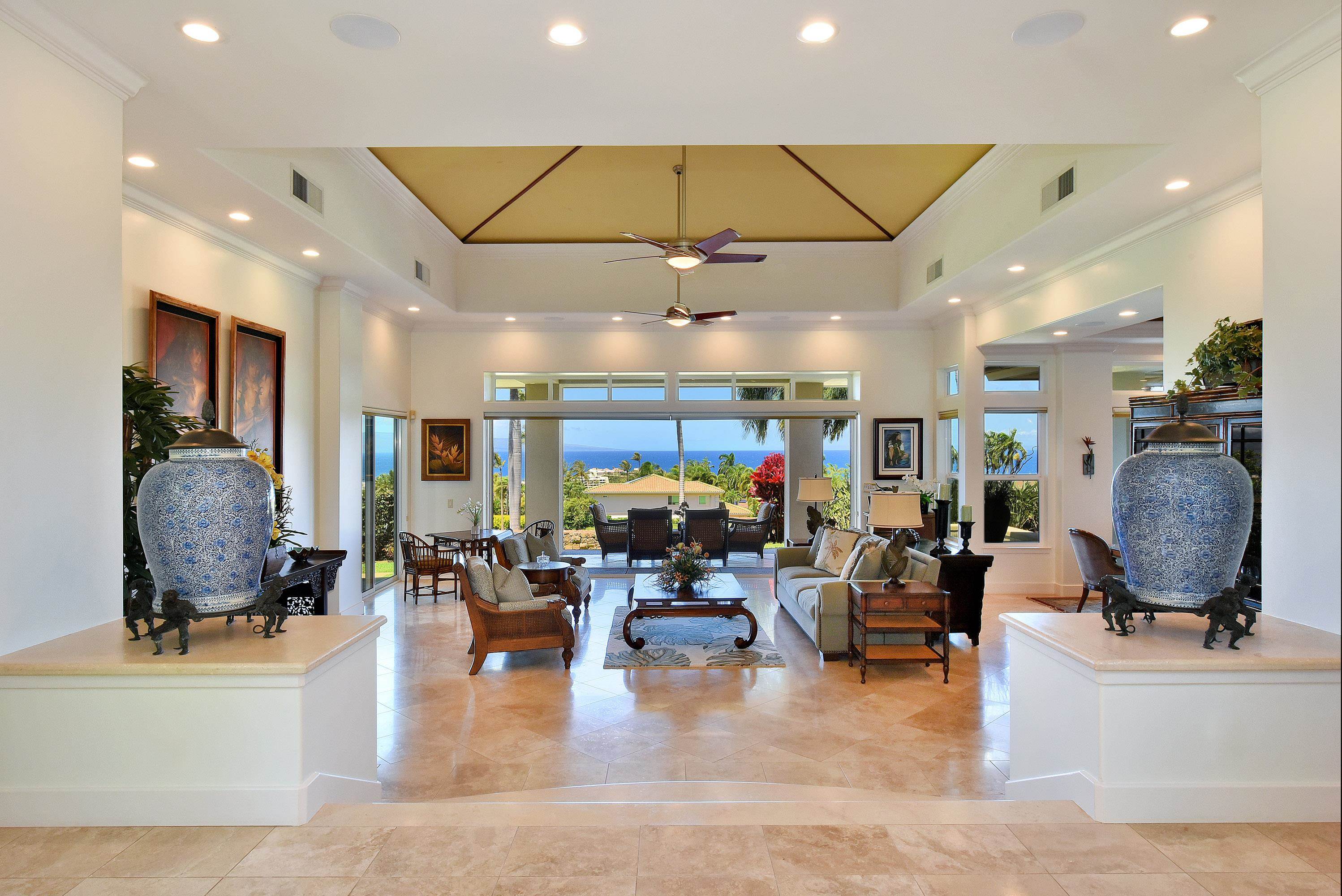 175 Ulukoa Place Lahaina, HI 96761 - Photo 13 of 50 a living room with lots of furniture and a large mirror
