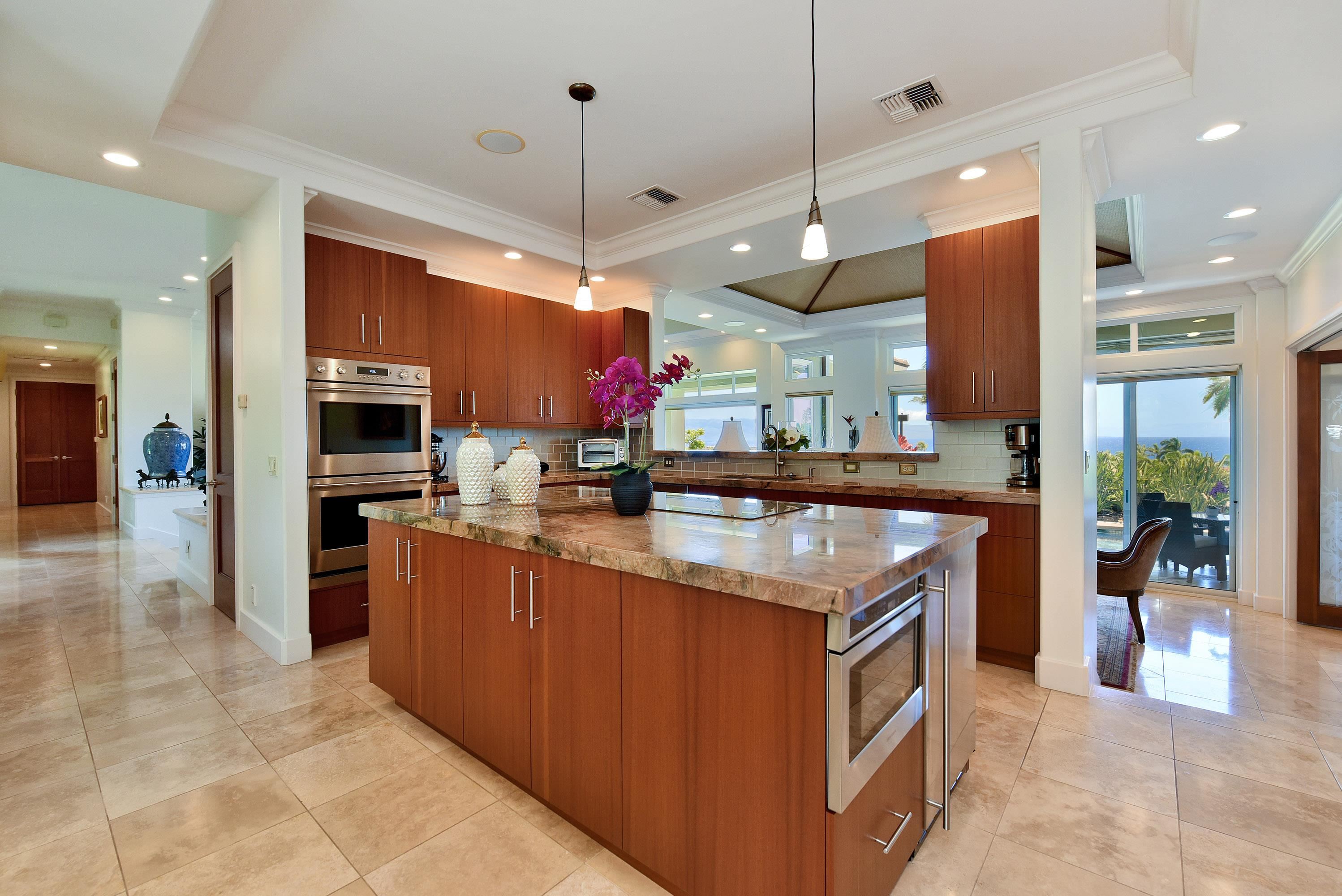 175 Ulukoa Place Lahaina, HI 96761 - Photo 19 of 50 a kitchen with stainless steel appliances granite countertop counter top space a stove and cabinets