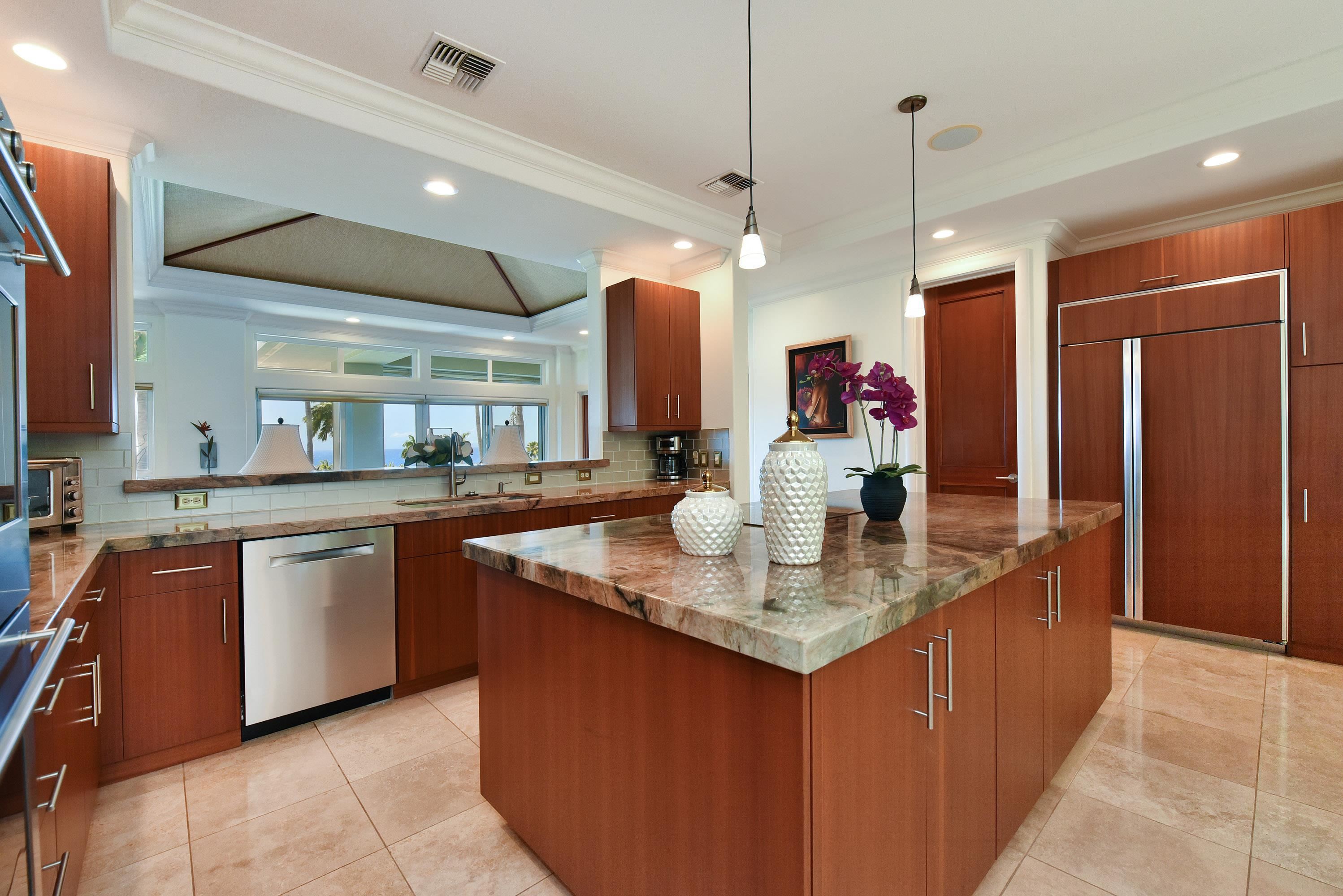 175 Ulukoa Place Lahaina, HI 96761 - Photo 20 of 50 a kitchen with stainless steel appliances granite countertop a sink and a refrigerator