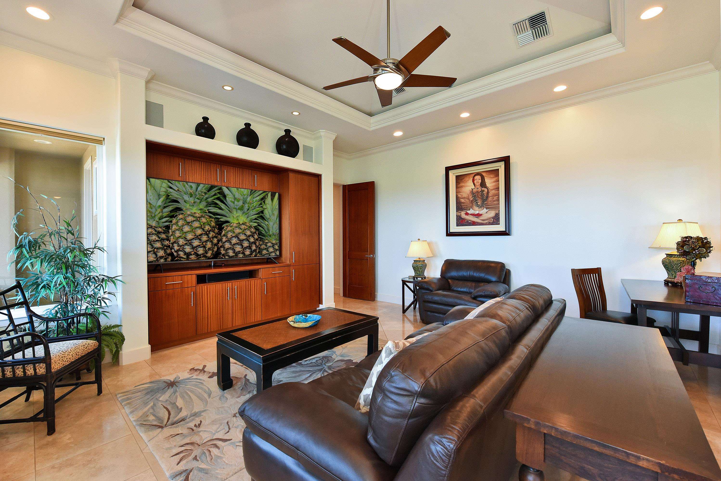 175 Ulukoa Place Lahaina, HI 96761 - Photo 23 of 50 a living room with furniture and a flat screen tv