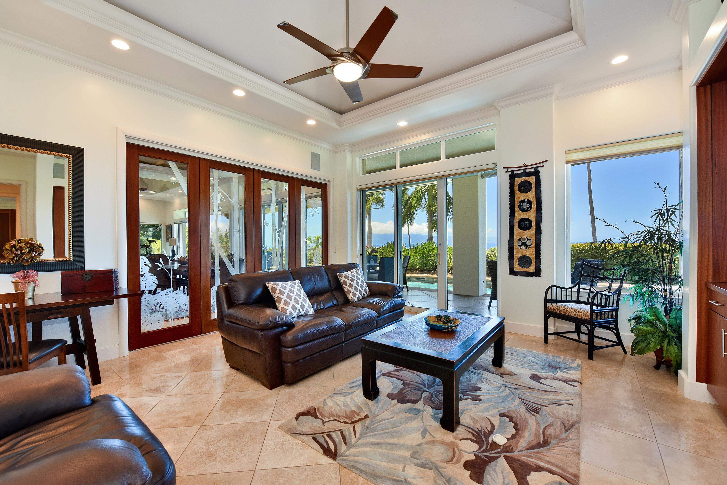 175 Ulukoa Place Lahaina, HI 96761 - Photo 24 of 50 a living room with furniture and a large window