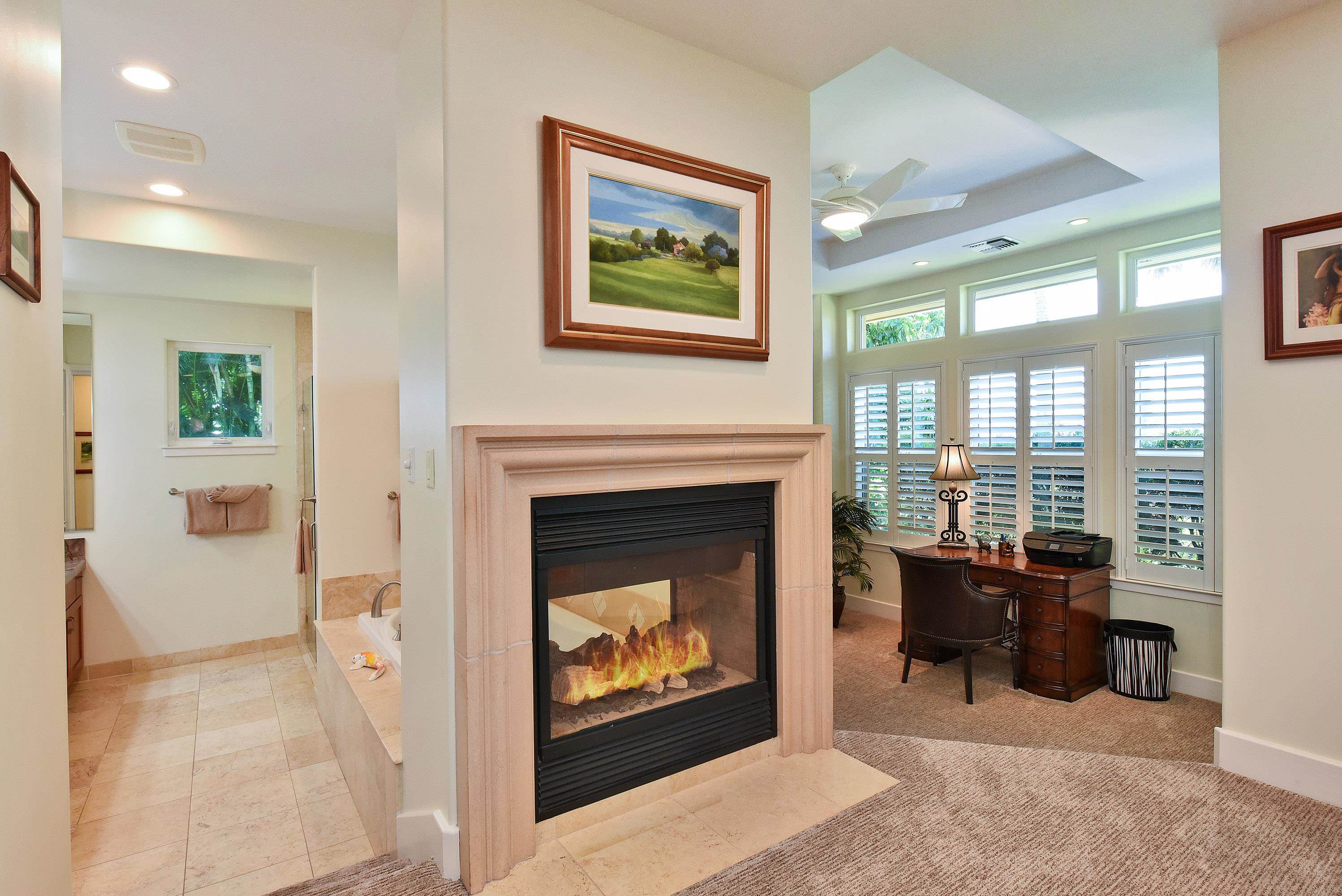 175 Ulukoa Place Lahaina, HI 96761 - Photo 28 of 50 a living room with furniture and a fireplace