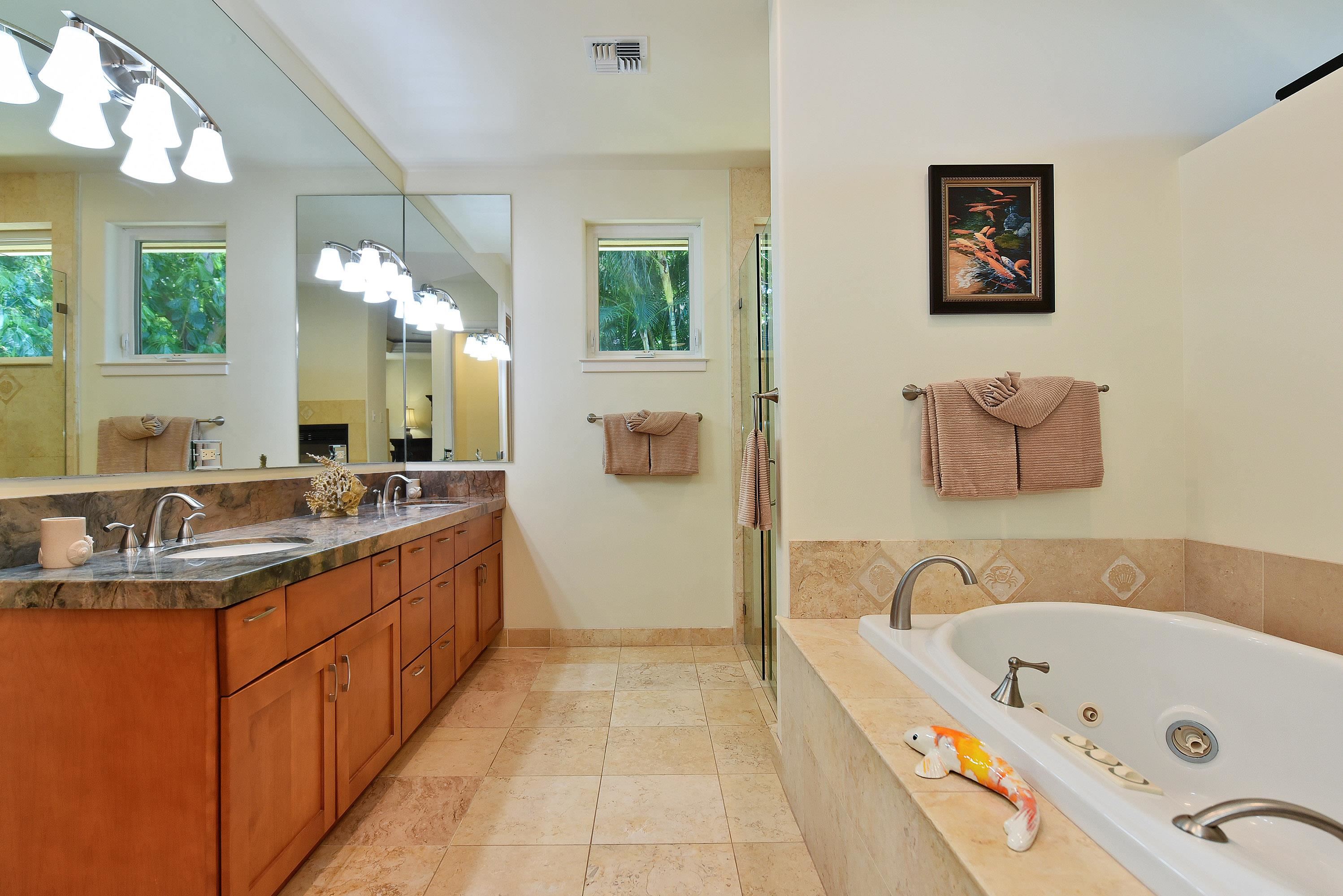 175 Ulukoa Place Lahaina, HI 96761 - Photo 30 of 50 a bathroom with a tub sink and mirror