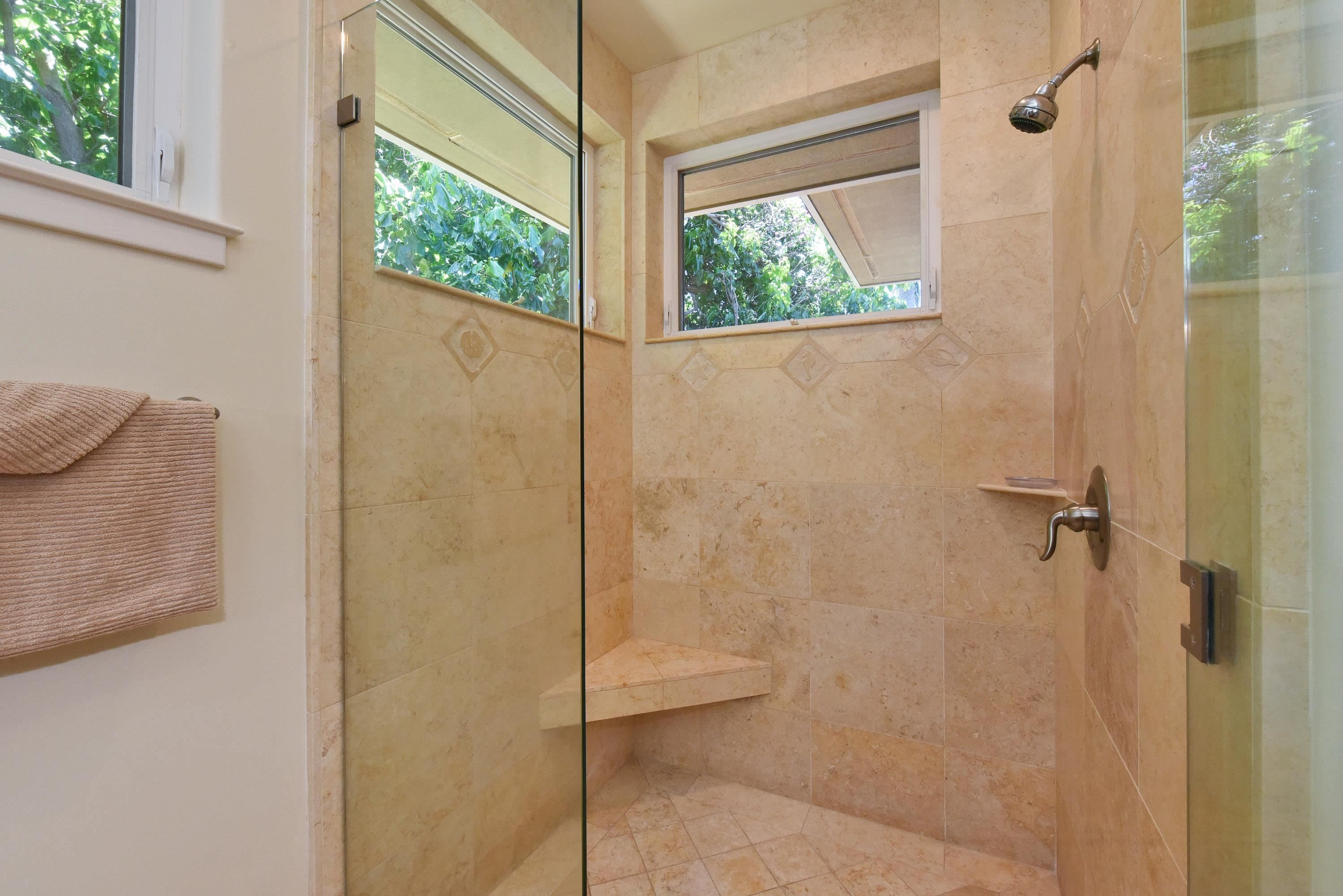 175 Ulukoa Place Lahaina, HI 96761 - Photo 32 of 50 a bathroom with a glass shower door
