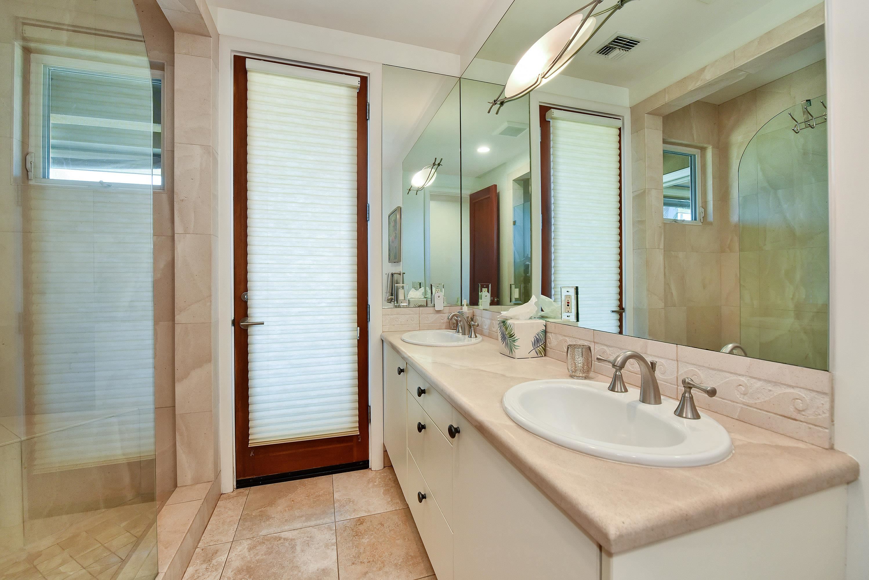 175 Ulukoa Place Lahaina, HI 96761 - Photo 34 of 50 a bathroom with a sink and a mirror