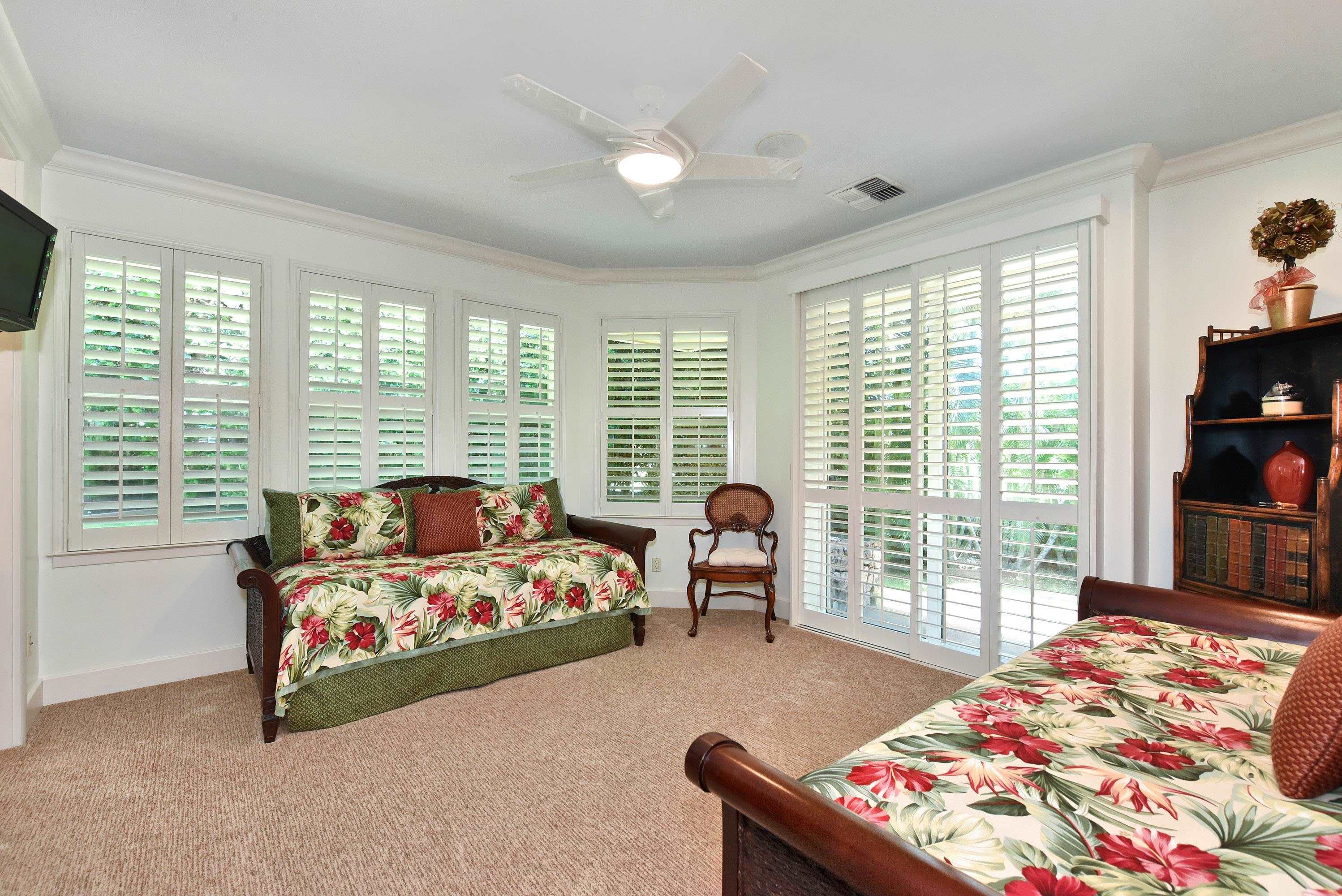 175 Ulukoa Place Lahaina, HI 96761 - Photo 35 of 50 a bedroom with bed and glass windows